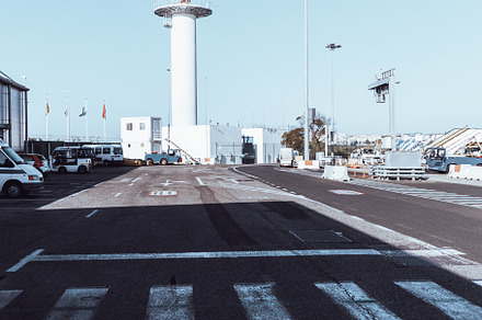 An airport outdoor area with a tower, a Transportation Photo by SkyNext