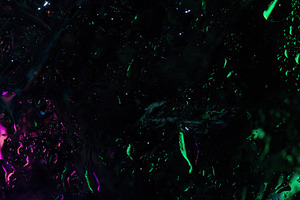 Dark abstract image of wet glass with glowing green and purple n, a Background Photo by Ales Munt