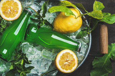 Bottles of green lemonade containing lemonade, green, and bottle, a Food & Drink Photo by Foxys
