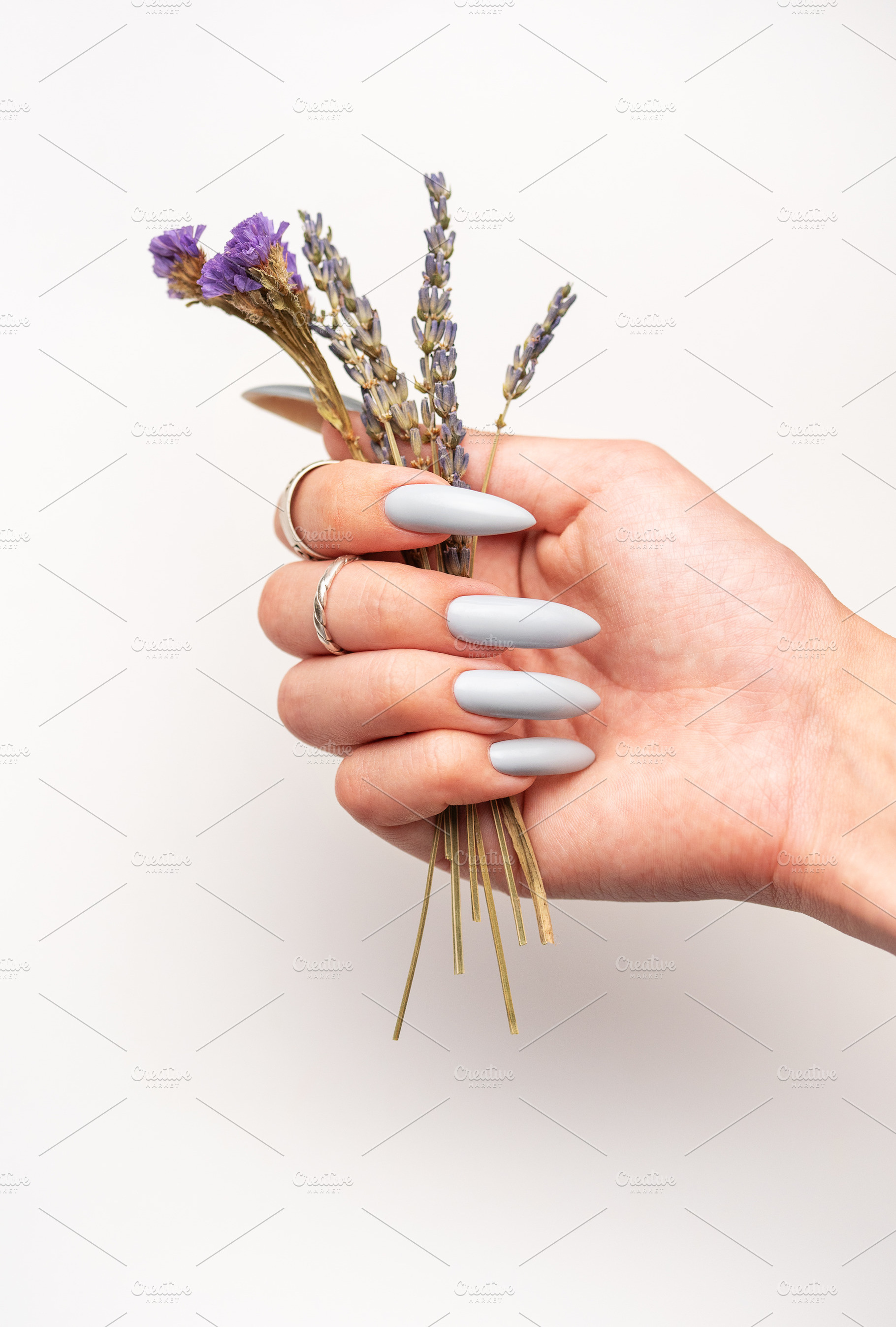 Close-up of a woman's hands with grey manicured nails, a Beauty & Fashion Photo by Olena Rudo