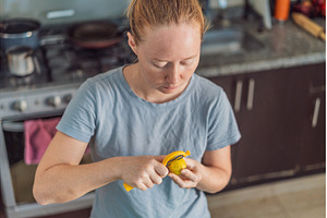 Woman preparing breakfast in a, a Food & Drink Photo by Elizaveta Galitskaya