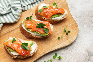 Smoked salmon toast with avocado and cream cheese, a Food & Drink Photo by Olena Rudo