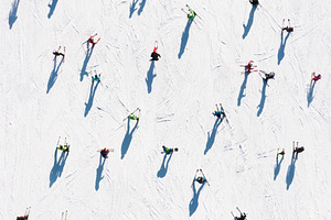 Ski resort. Aerial view of skiers and snowboarders. Winter sport