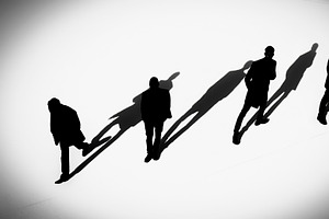 Fourth people walking with diagonal elongated shadows, a Person Illustration by DanFLCreativo