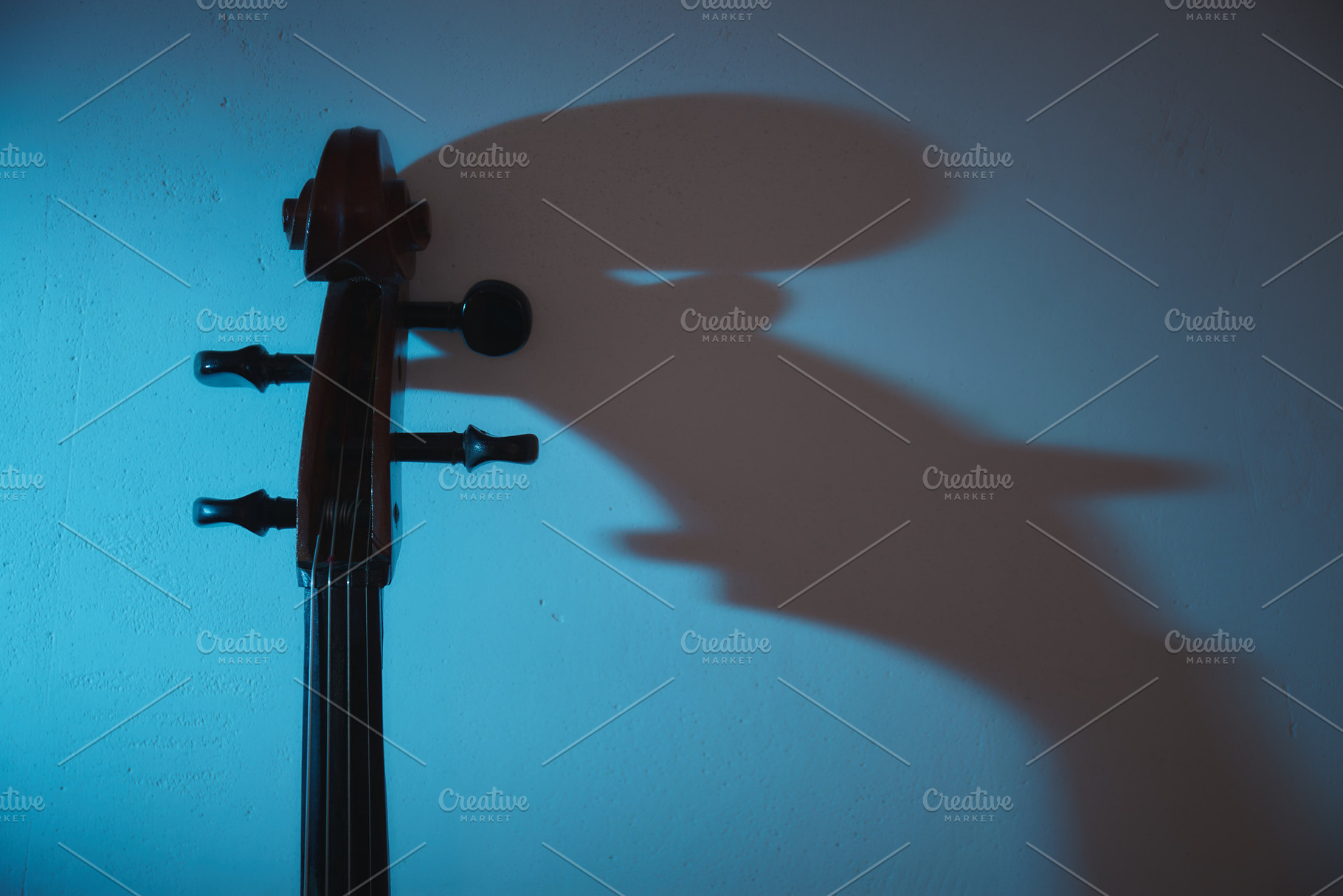 Cello in dark room, a Background Photo by OleksandrRybitskyi