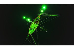 Squid fishing boat illuminating the, a Transportation Photo by Goinyk