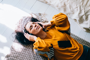 Woman 40s relaxing and listen music, a Person Photo by hitdelight
