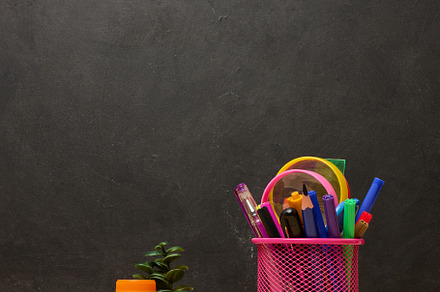 Colored pencils and watercolor paints on chalk board background,