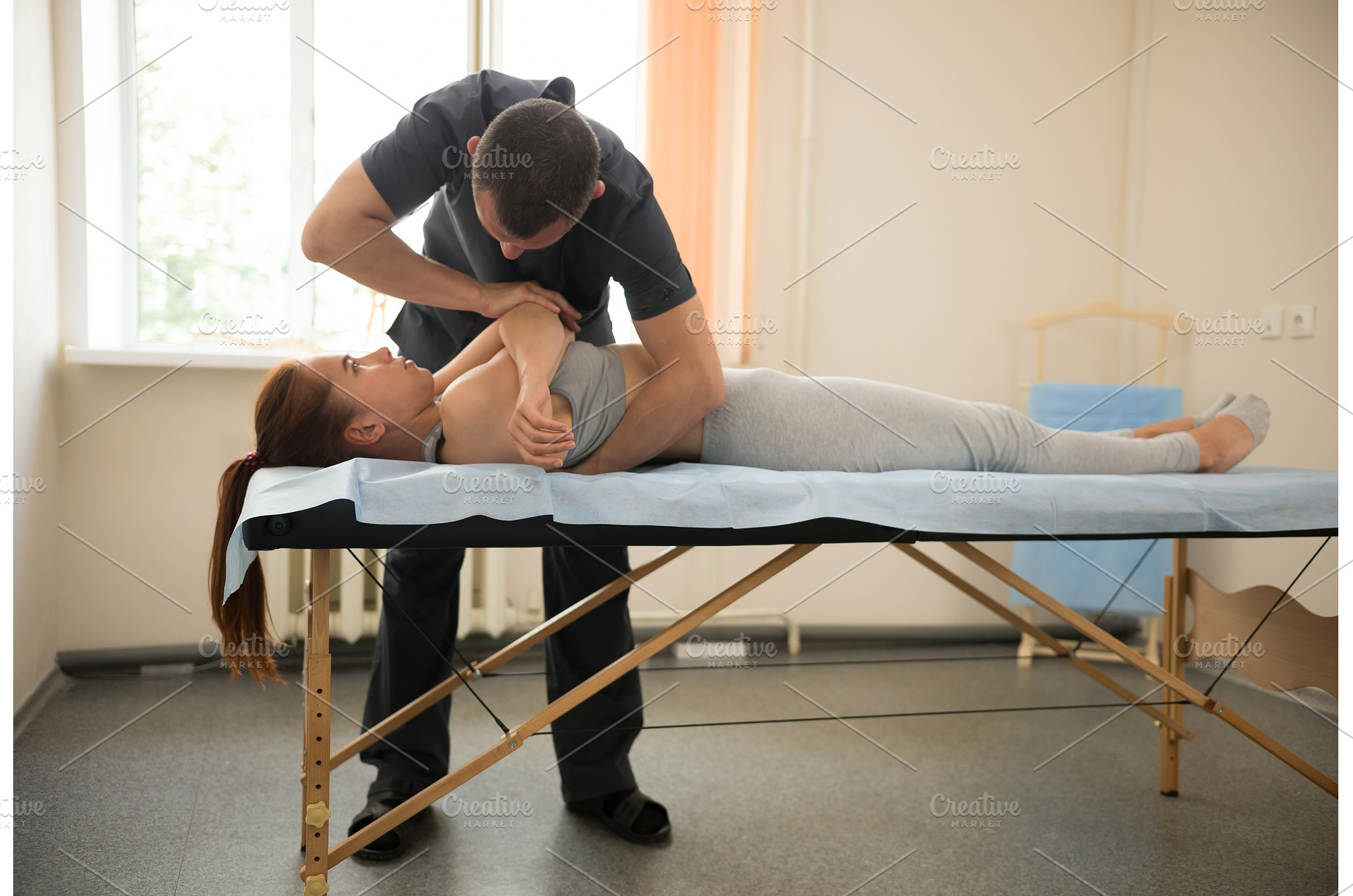 Young woman having osteopathy, a Health & Medical Photo by Barcelona_dreams