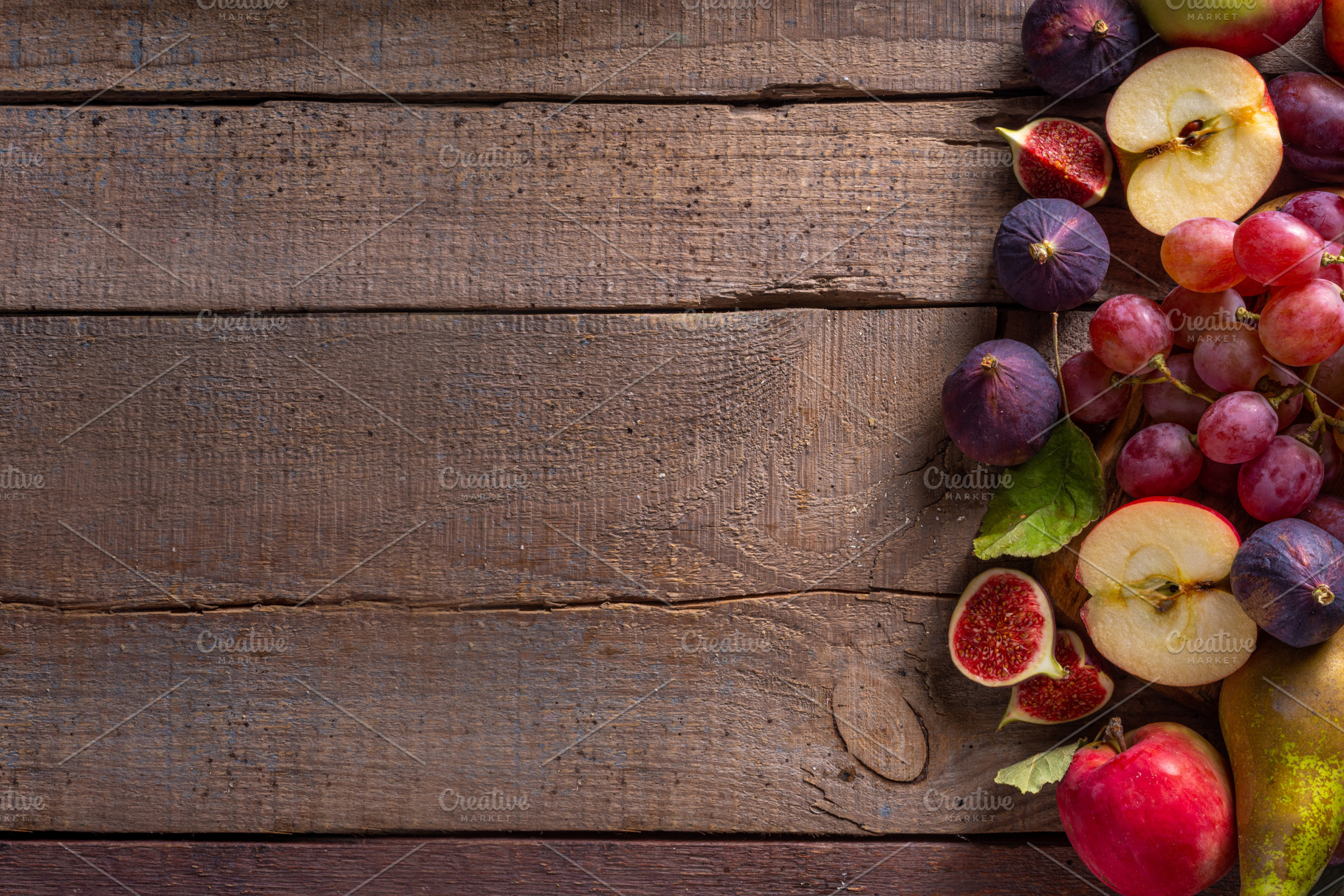 Autumn fruit assortment on wooden background, a Food & Drink Photo by Rimma