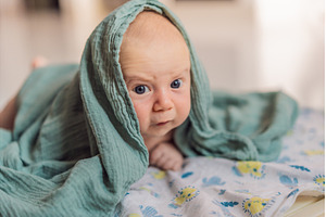 One-month-old baby lying on tummy, a Food & Drink Photo by Elizaveta Galitskaya
