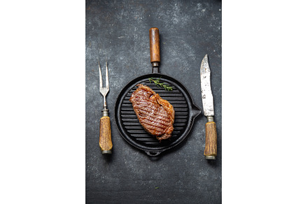 Fried strip loin steak on vintage, a Food & Drink Photo by LARISA BLINOVA