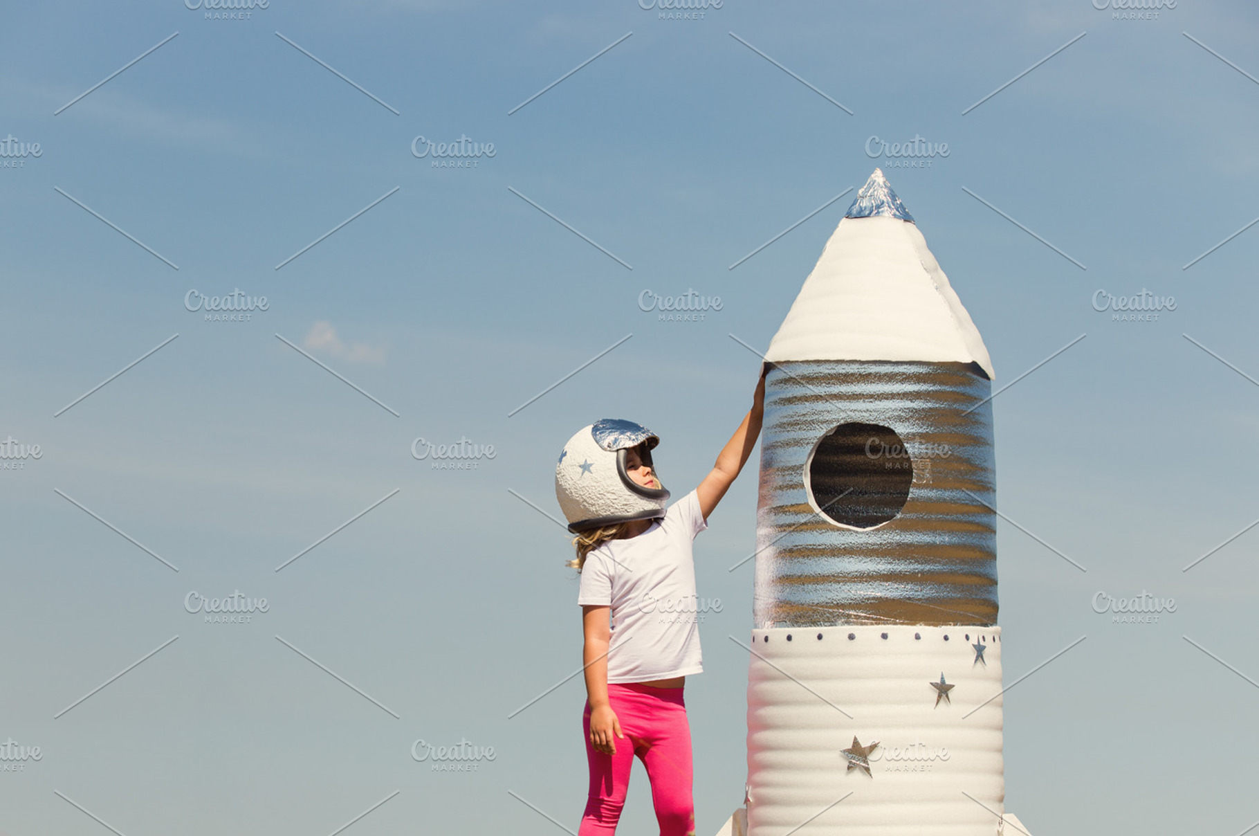 Happy child dressed in an astronaut, a Person Photo by Maksimkostenko