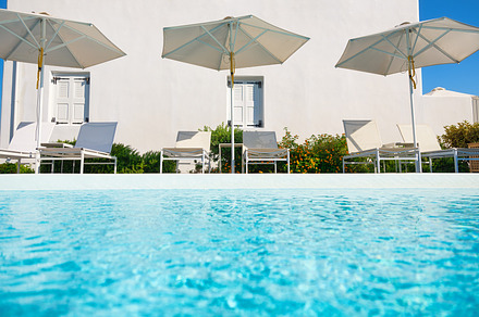 Umbrellas by the pool. Rest by the water in hot weather., a Holiday Photo by Landscape and travel