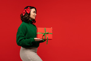 Woman in green sweater and bow, a Holiday Photo by Elena Vagengeim