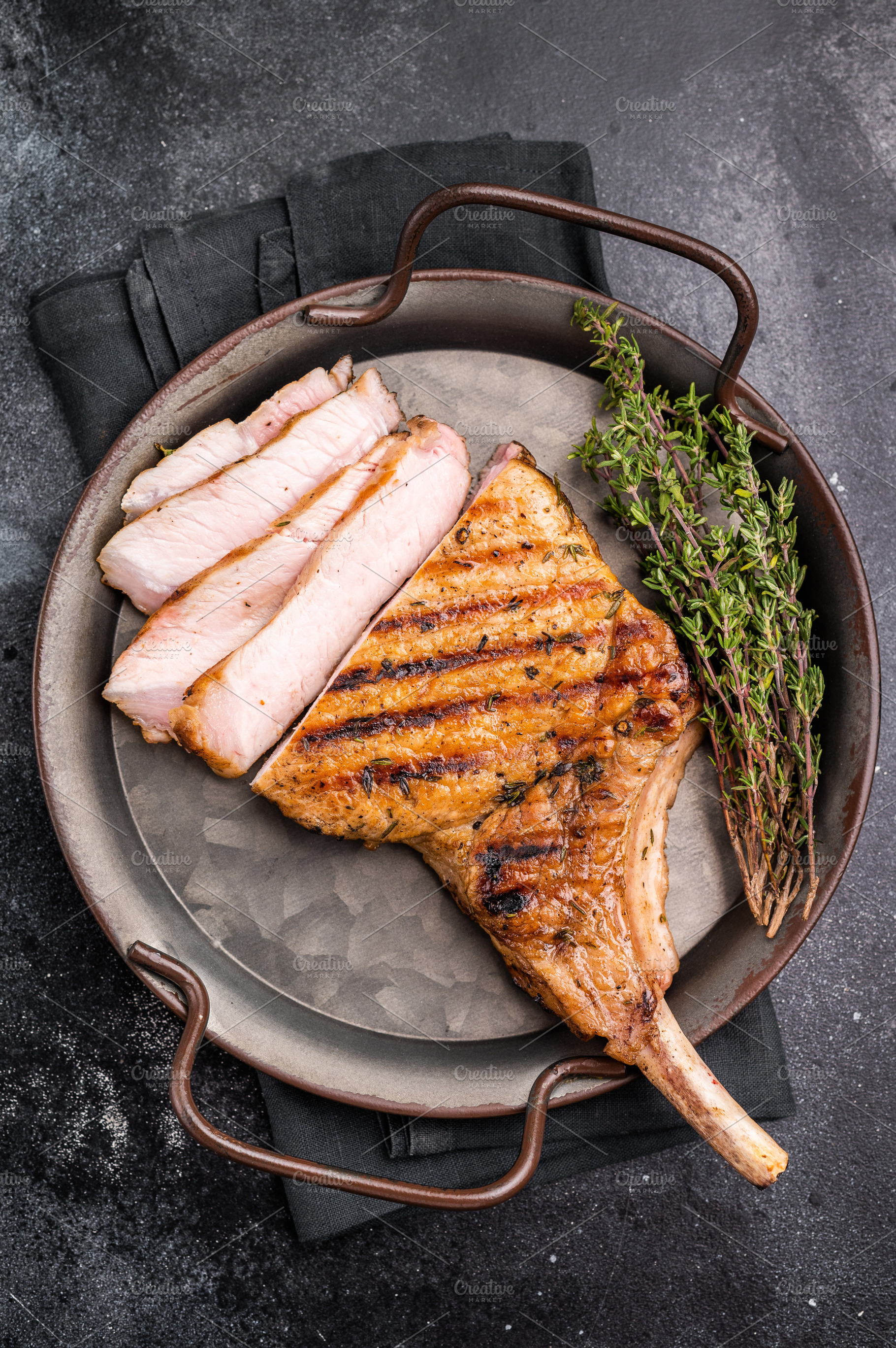 Flavorful grilled pork loin chop with bone, expertly cooked to p, a Food & Drink Photo by composter-box@mail.ru