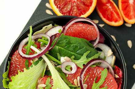 Concept of tasty food, salad with red orange, top view, a Food & Drink Photo by AtlasStudio PRO