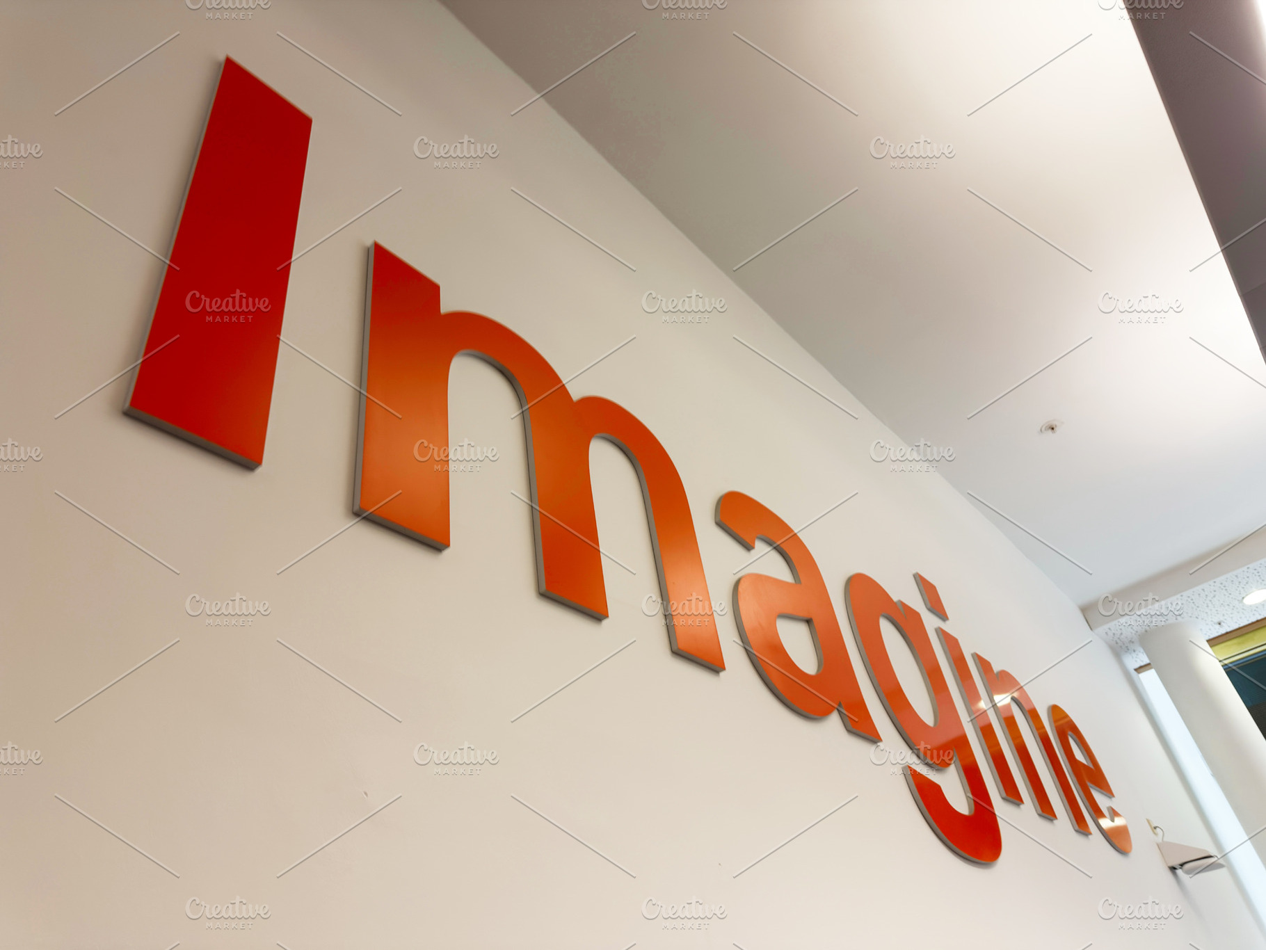 Imagine sign on office wall in Liverpool UK showcasing orange branding and crea, a Photo by AS photostudio