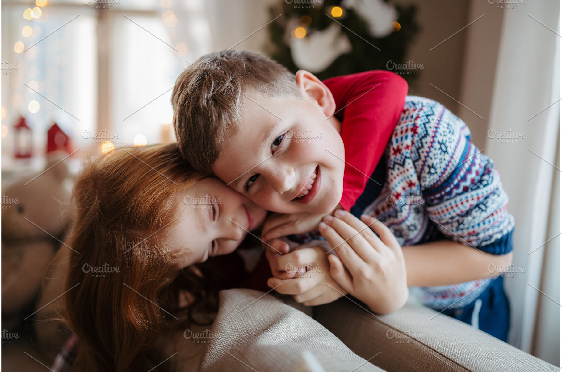 Small girl and boy in pajamas, a Person Photo by HalfPoint