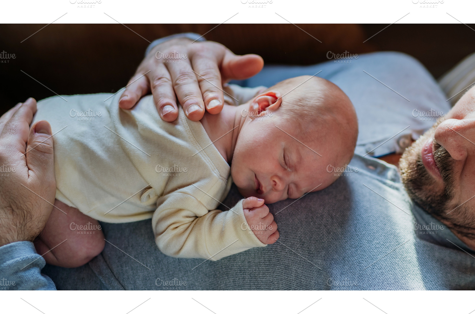 Close-up of father cudddling his, a Person Photo by HalfPoint