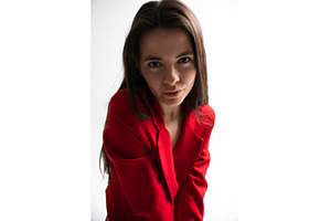 Young woman in a vibrant red blazer, a Person Photo by volodymyrshtun13795