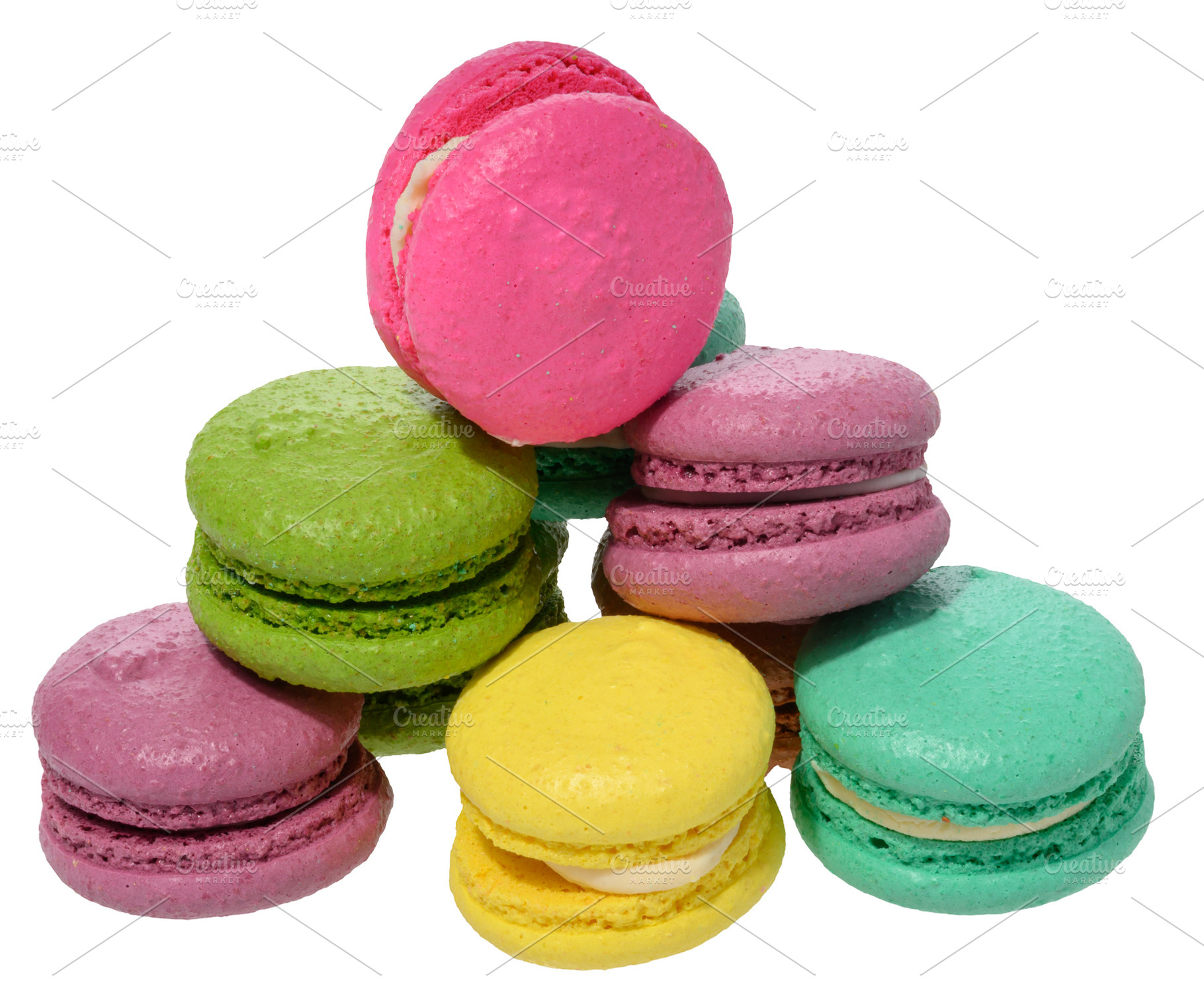 An assortment of colorful macarons, isolated background, a Food & Drink Photo by ndanko