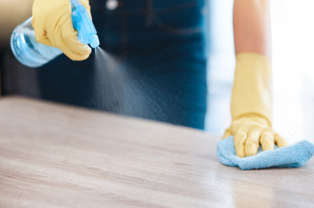 Cleaning, housekeeping and hands with spray bottle on furniture for spring cleaning, dust and dirt on surface. Housework, healthcare and person with rubber gloves, cleaning products and disinfection, a Photo by Peopleimages.com