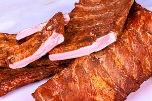 Cooked meat ribs on white surface, a Food & Drink Photo by Ungvar Studio