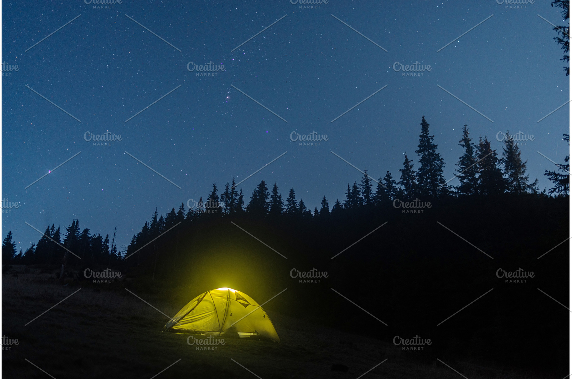 Illuminated camping tent under a, a Nature Photo by Stockphoto by vzwer