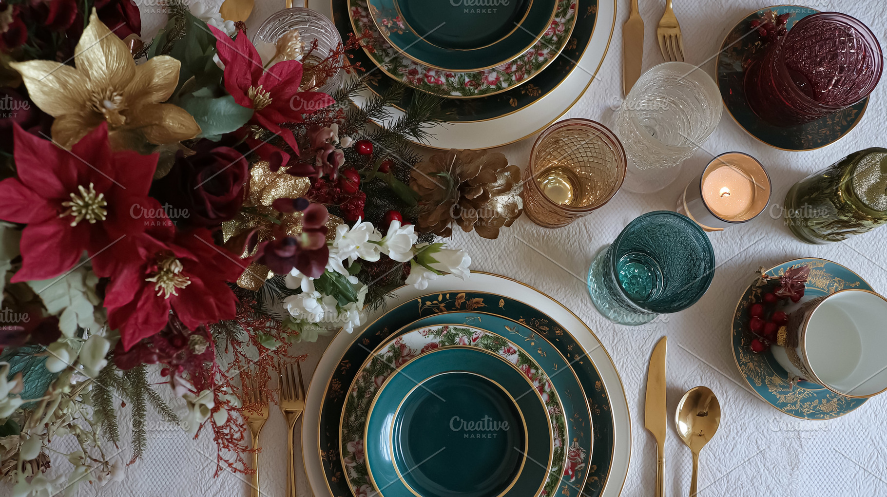 Christmas dinner table setting with elegant poinsettia centerpiece, festive dec, a Food & Drink Photo by Studio ANNA