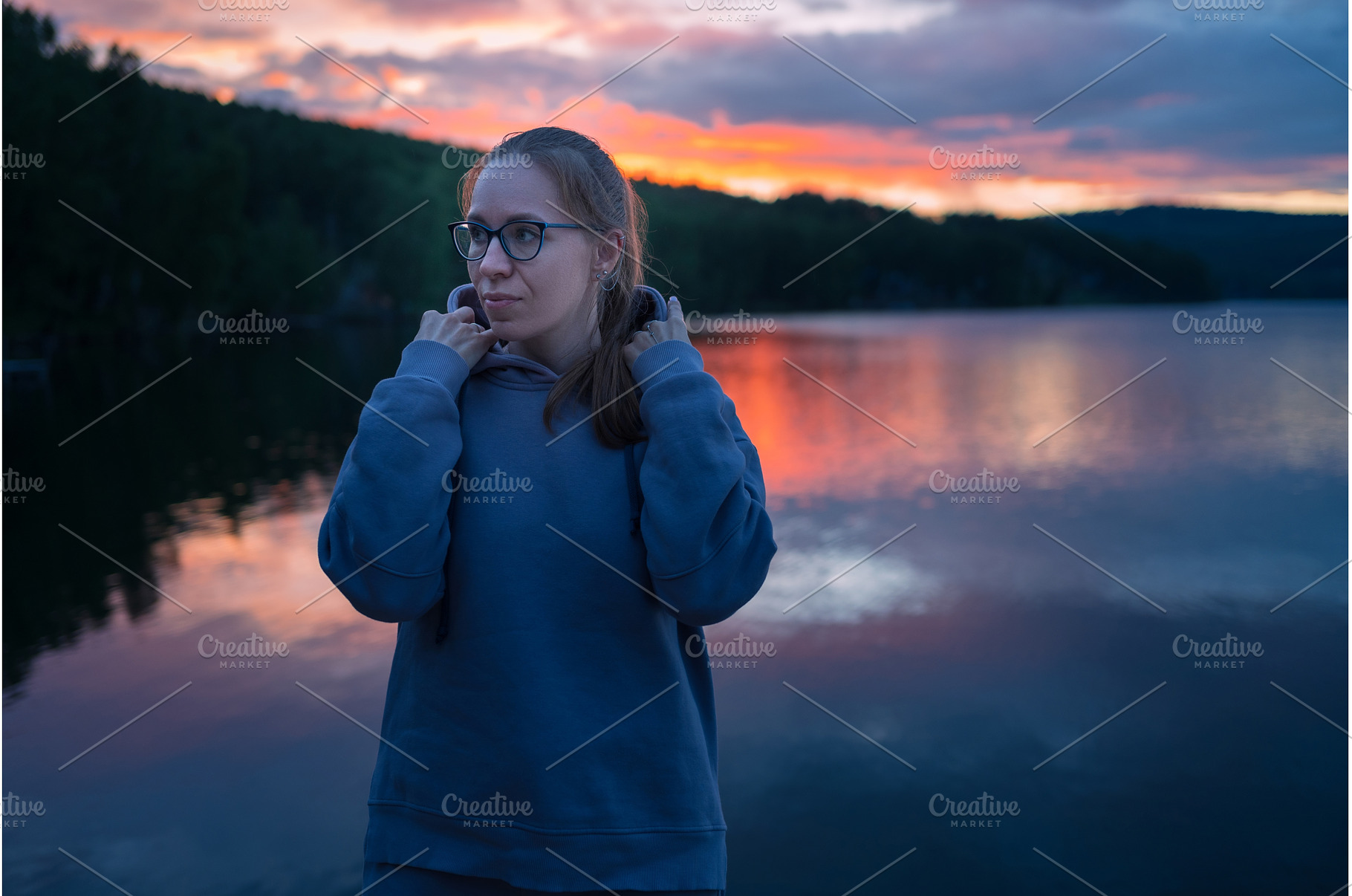 Woman sitting on the pier, a Person Photo by Jan Jack Russo Media