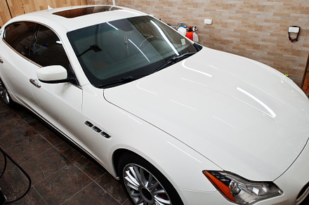 White new luxury sport car in detailing garage., a Transportation Photo by AS photostudio