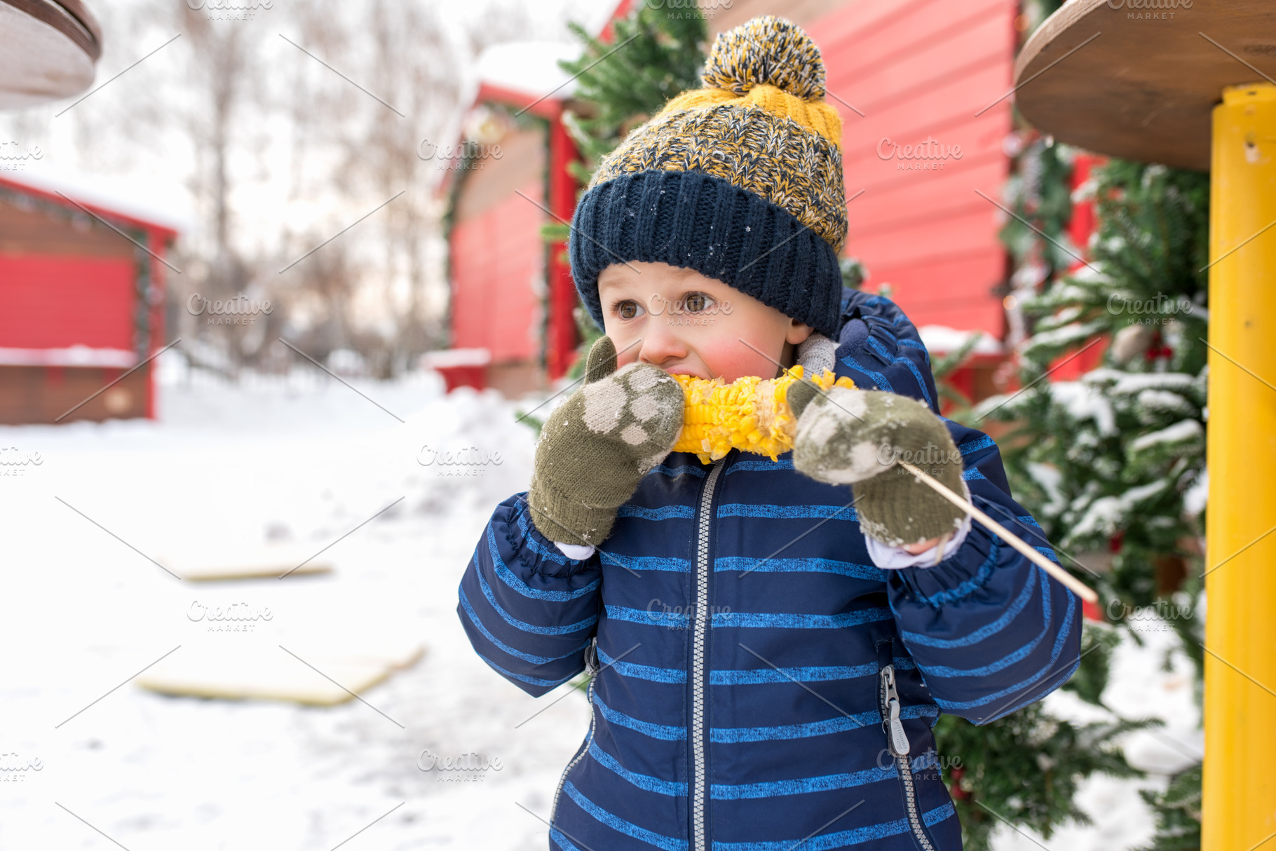 Little boy eats boiled corn in stock photo containing corn and hot, a Person Photo by byswat