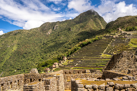 Panoramic view of Machu Picchu ruins with Huayna Picchu in backg