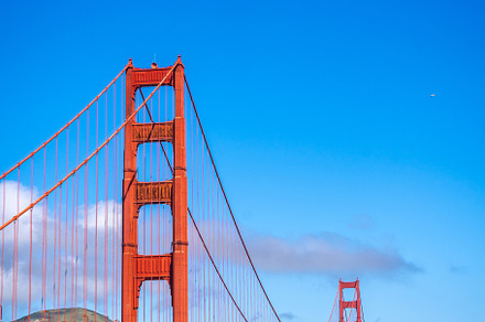 Golden Gate Bridge over blue waters with scenic hills in San Fra, an Architecture Photo by GoodGoods