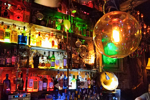 Colorful bar interior with neon lights and bottles, an Architecture Photo by DanFLCreativo