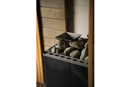 Sauna heater with pile of stones