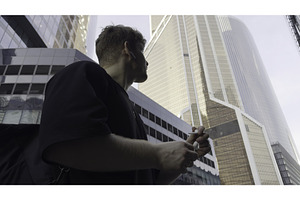 Young manager walking and talking on, an Architecture Photo by Media Whale Stock