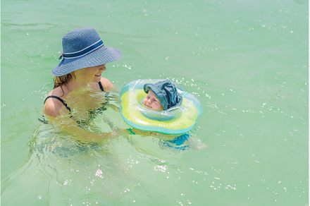 Baby floating in a neck ring in