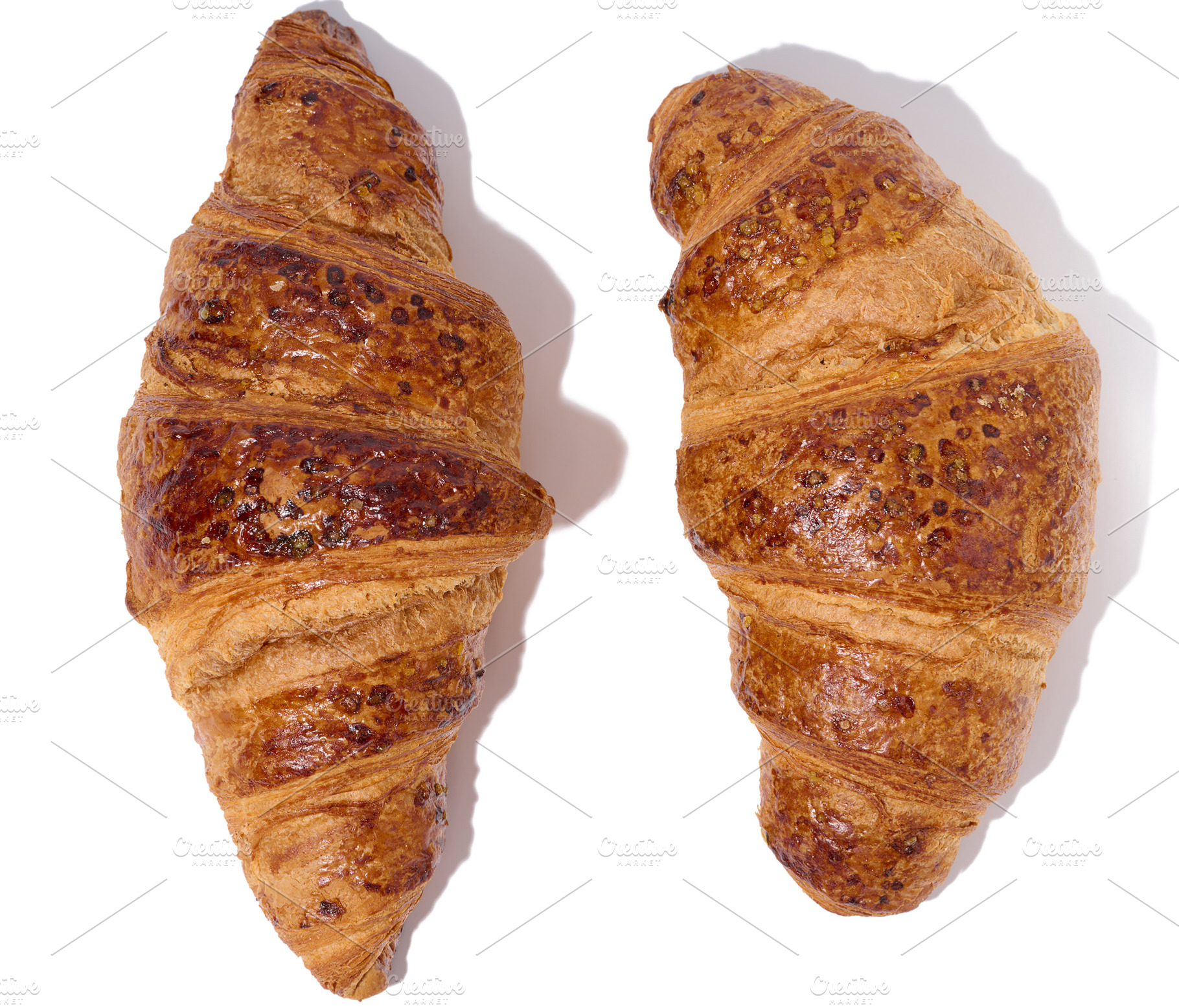 Baked croissant on a white isolated background, top view, a Food & Drink Photo by ndanko