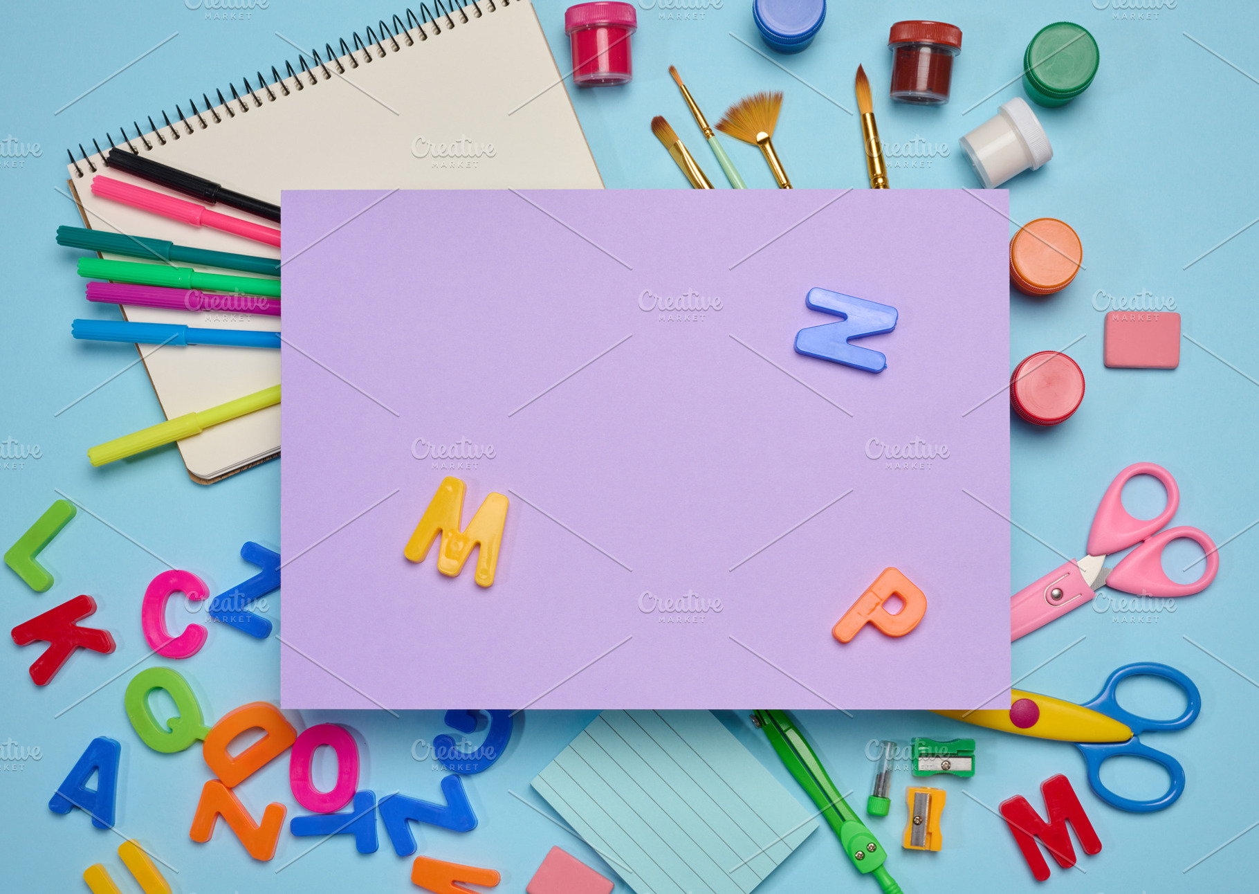 A rectangular sheet of lilac paper in the center, with school su, a School & Education Photo by ndanko