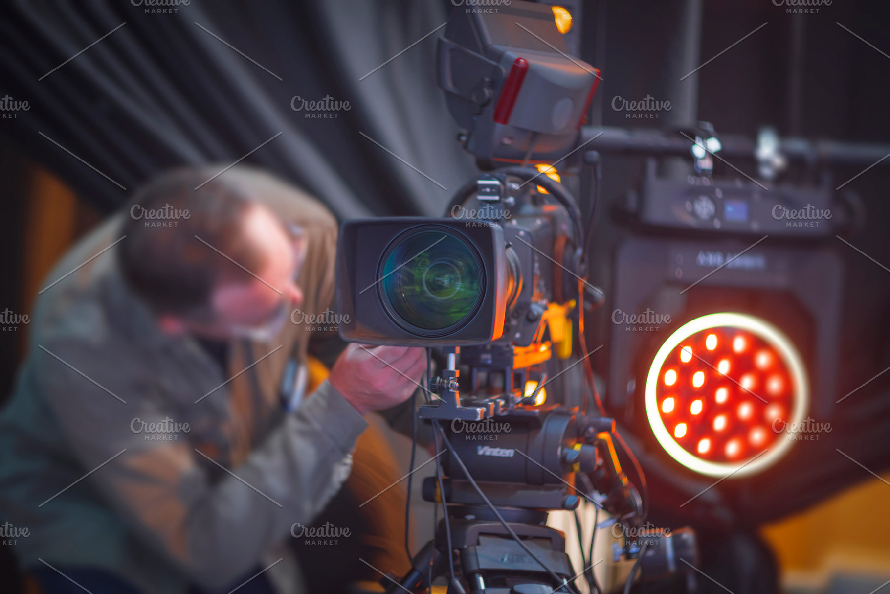 Professional videographer technician adjusting lens on broadcast, a Photo by Pictures for you!!!!!!!!!
