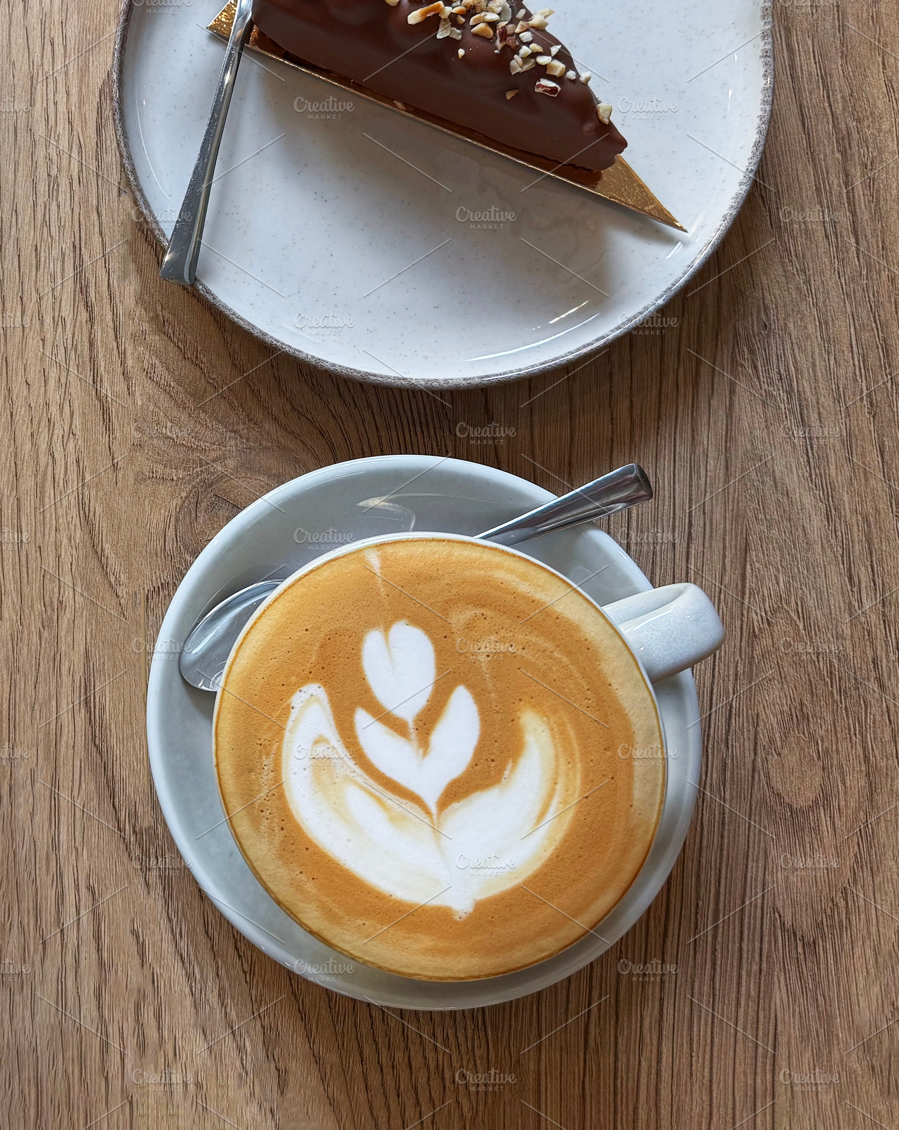 Coffee latte art and chocolate cake dessert serving, a Food & Drink Photo by Olena Rudo