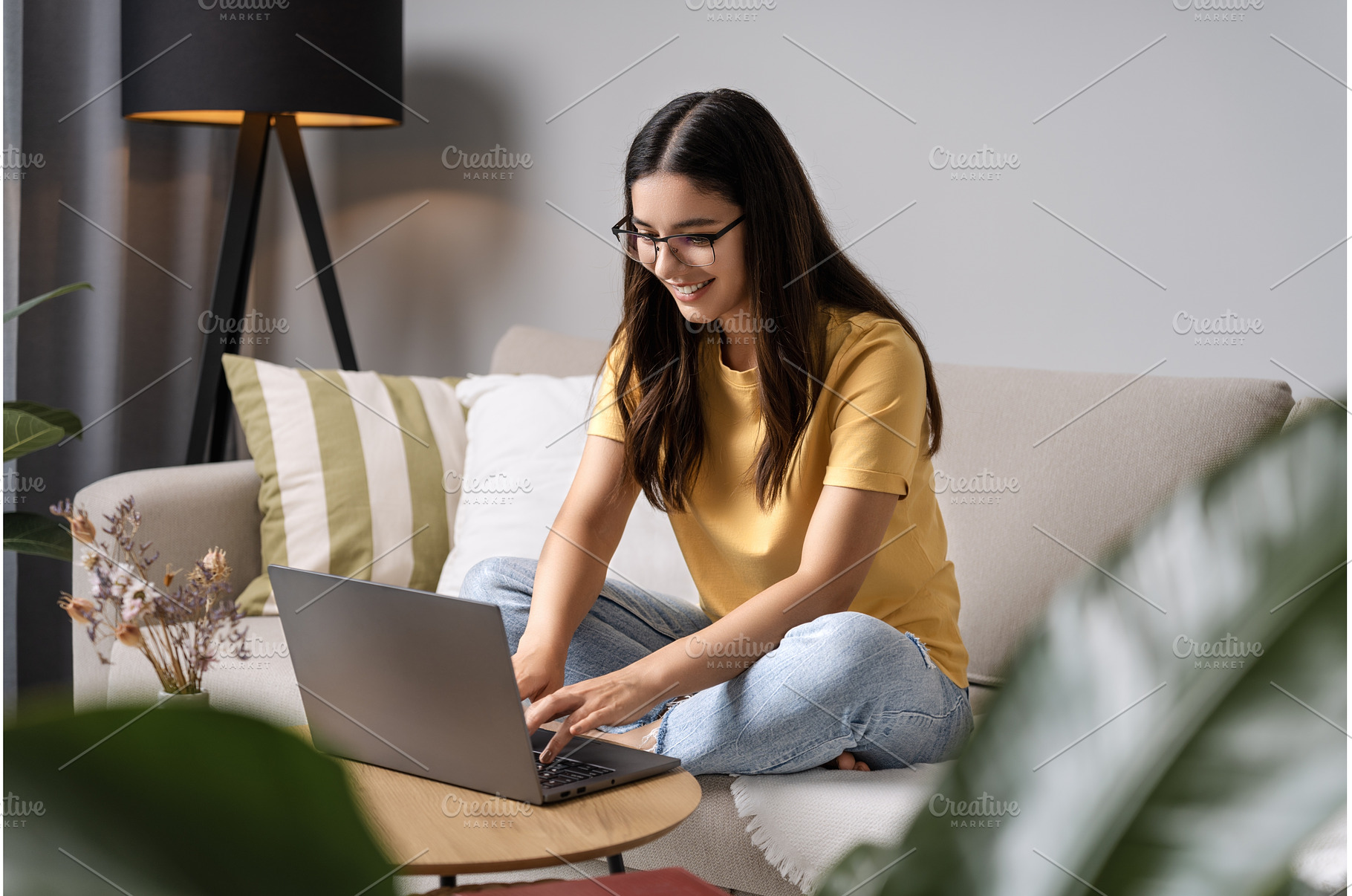 Young woman with glasses leans into, a Person Photo by AD Stock Images