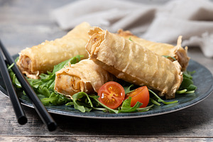 Crispy vegetables spring Rolls on wooden table, a Food & Drink Photo by etorres69