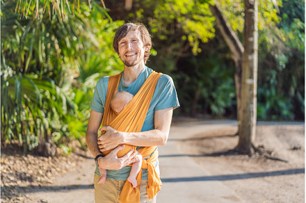 Father holding his little baby in a
