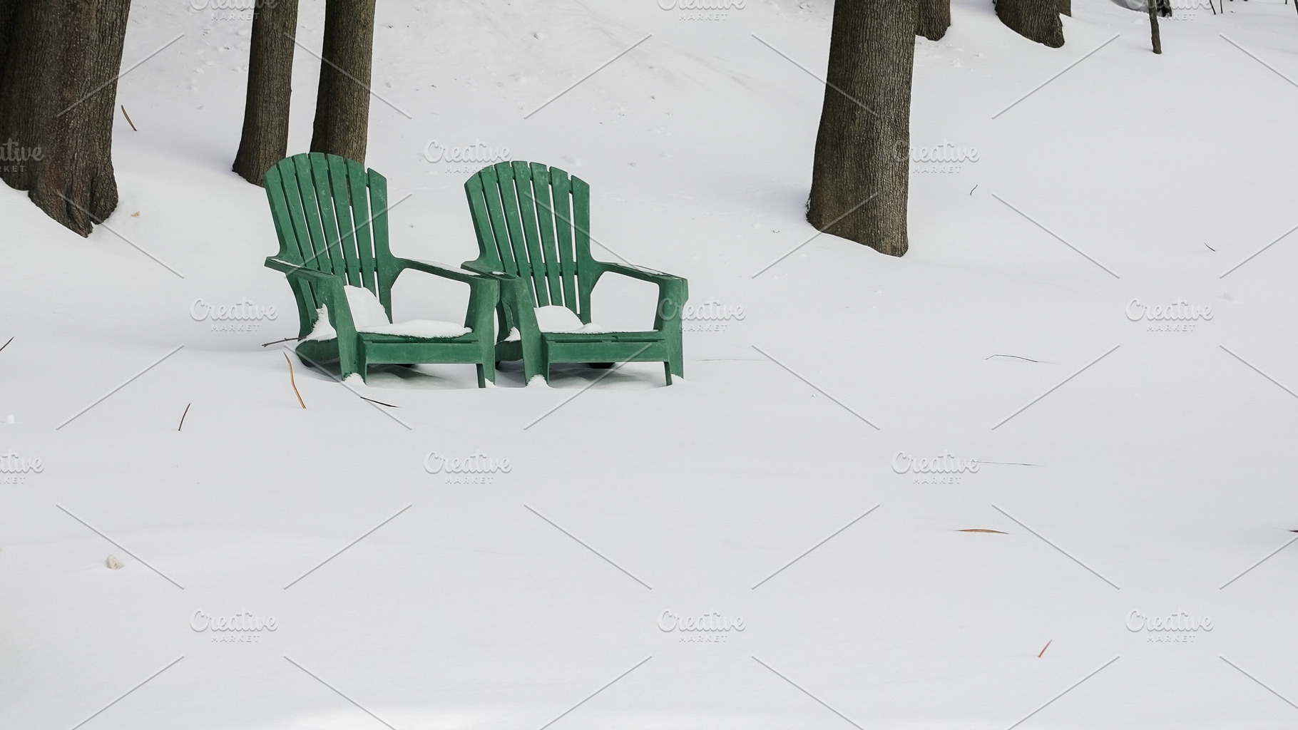 Chairs sit in a snowy area surrounde, a Nature Photo by 1miromiro
