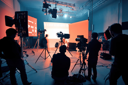 Crew members working in a studio, a Photo by Pavel_design