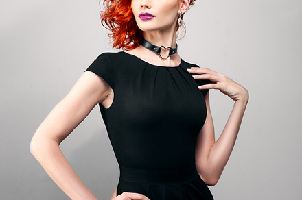 Beautiful woman with red hair in a black dress stock photo containing fashion, a Beauty & Fashion Photo by sport&beauty stock photo