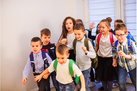 Group of happy little school kids in, a Person Photo by oksix